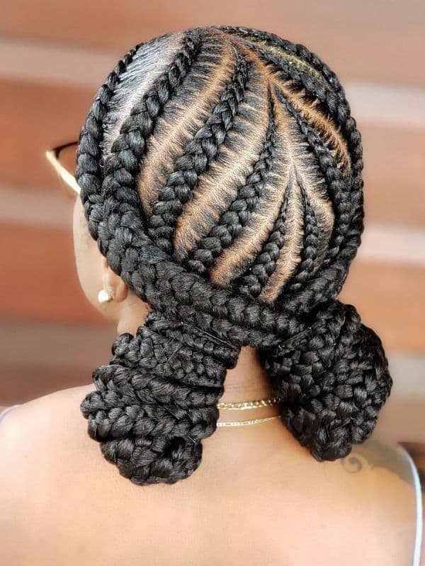 Large Tribal Braids With Two Low Buns