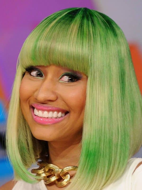 A green neon bob hairstyle that the crowd can’t look away