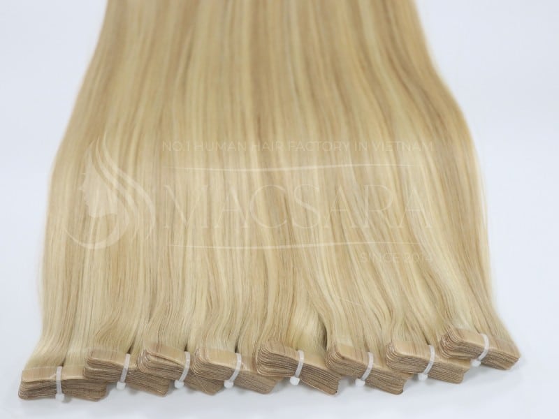 Tape-in hair extensions with a strip of adhesive tape attached to the top