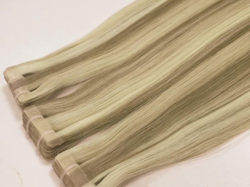 Tape-in hair extensions with seamless hair