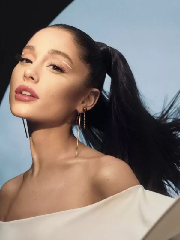 Ariana embraces a playful vibe with high pigtails