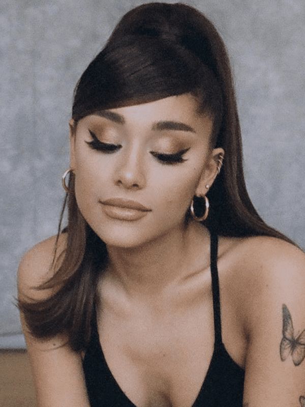 Ariana Grande's ponytail achieves a romantic look with a half-up