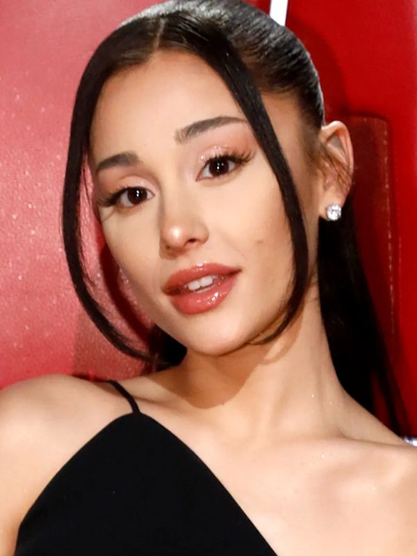 Ariana opts for a high ponytail with long bangs that frame her face