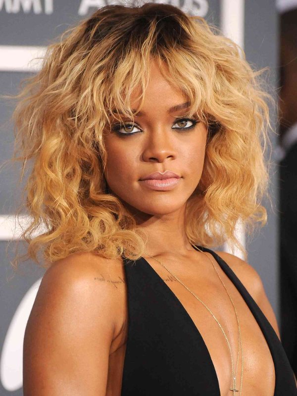 Only a cool cat like Rihanna can pull off a honey blonde paired with dark roots