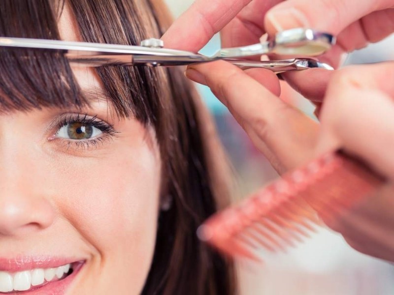 Trim hair topper to create bangs 