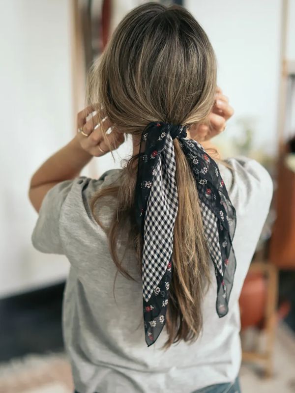 Low ponytail with a scarf