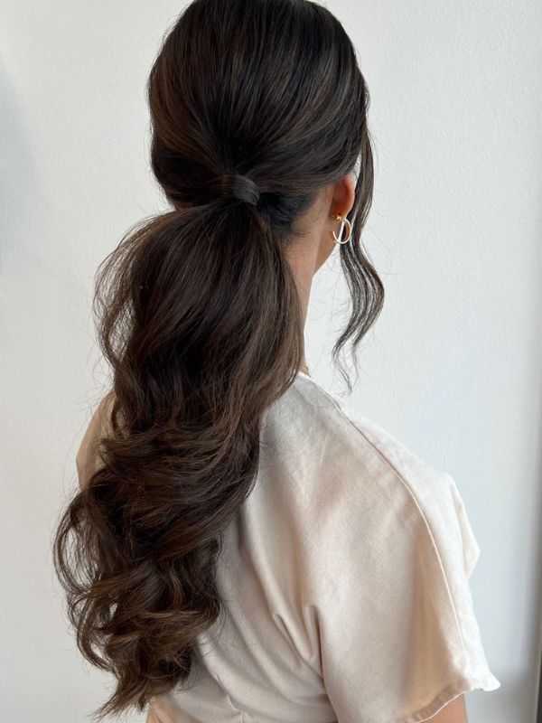 For a sleek, professional look, the low ponytail is your go-to