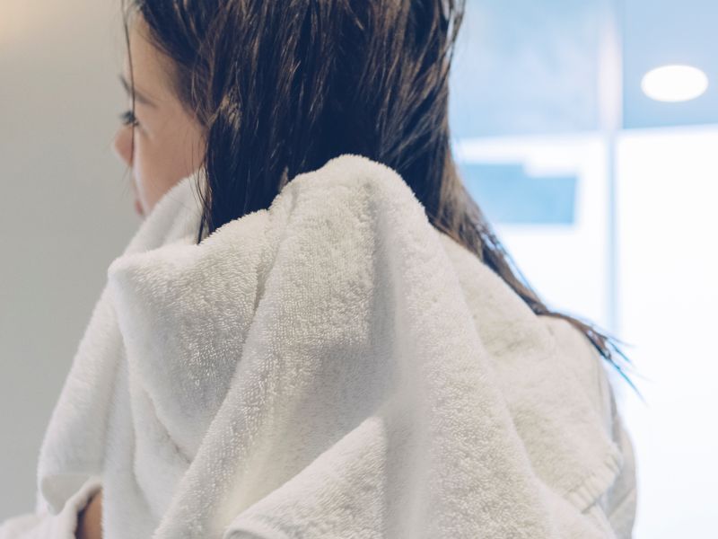 Pat dry your hair with a towel