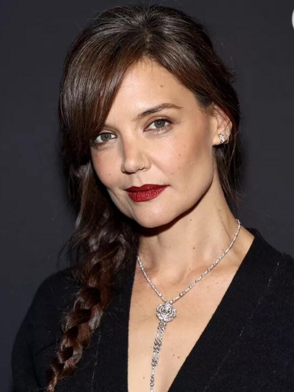 Katie Holmes opts for a long, side-swept braid that enhances her diamond-shaped face